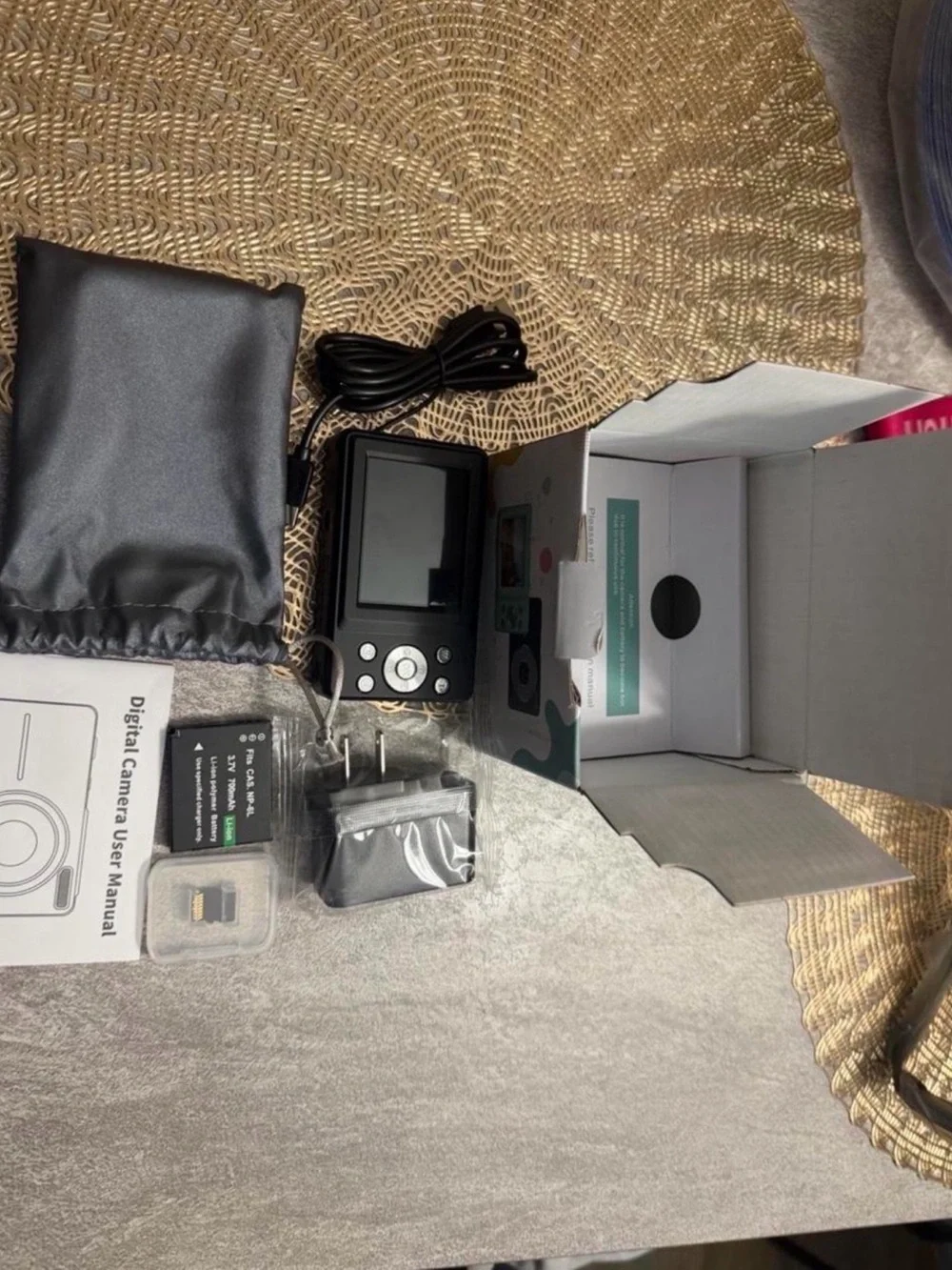 Compact Digital Camera with Black Finish and Accessories